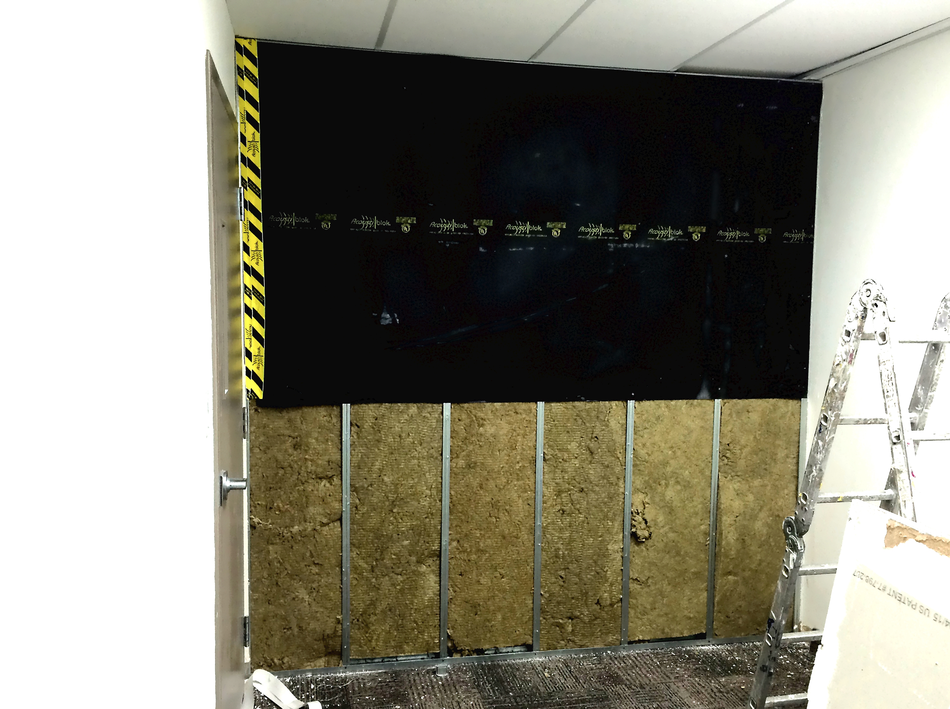 When securing Acoustiblok material to studs, using as few screws as possible reduces the amount of connectivity and maximizes the sound reduction of the wall.