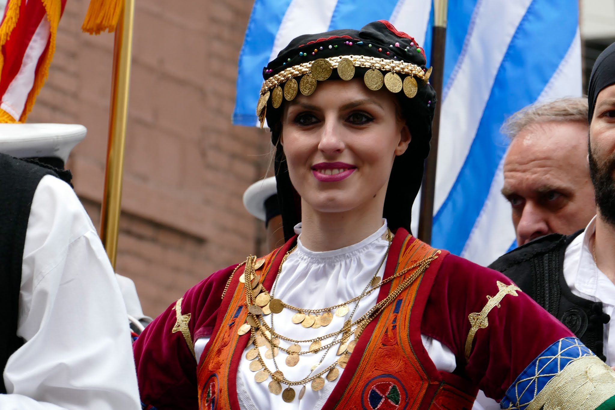 A woman in traditional Greek dress at the annual Detroit Greek Independence Day Parade.