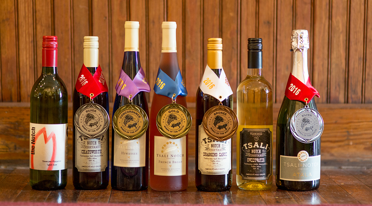 Hiwassee, third from the left, is the most decorated wine in Tennessee. It stands with other award-winning wines from Tsali Notch Vineyard in Madisonville, Tennessee.