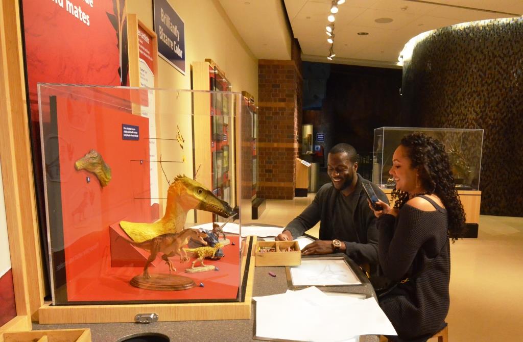 Drawing dinosaurs was part of this couple's date night during Museum by Moonlight at the world's largest children's museum