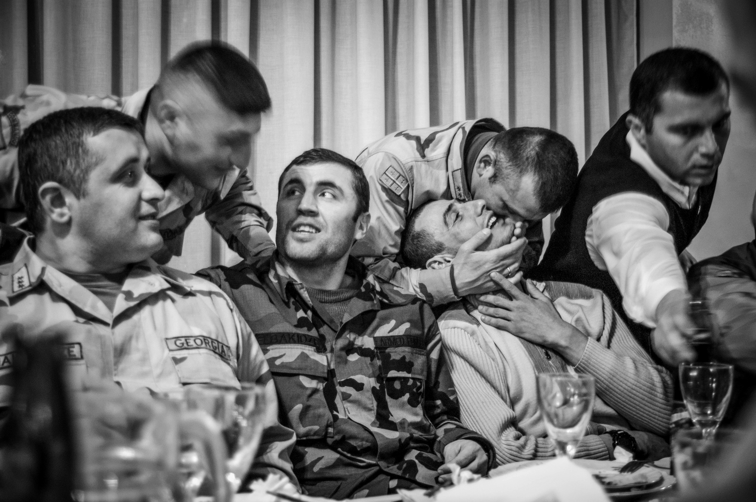 Farewell party for the first Georgian soldiers deployed to Iraq. Tbilisi. 2005.  © Justyna Mielnikiewicz