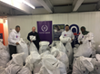 Human Appeal with bags of donated winter clothing for Wrap Up Manchester