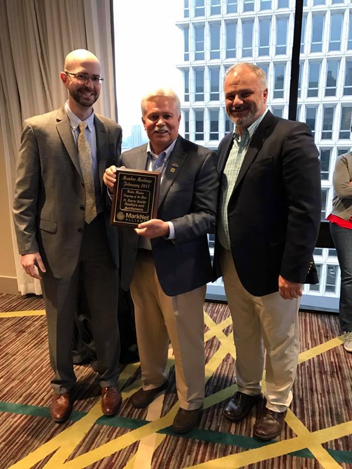 Matt Corso (left) and JJ Dower (right) present the award for Rookie Member Company of the Year to Rick Simpson (middle) of H. Barry Smith Real Estate and Auctioneers