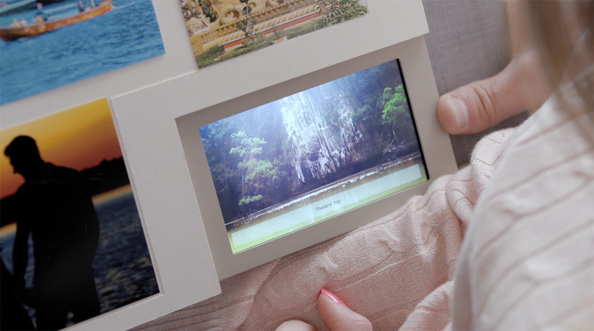 The touch-screen display is visible from every page, so users can view vivid prints alongside digital photos and video, even when offline