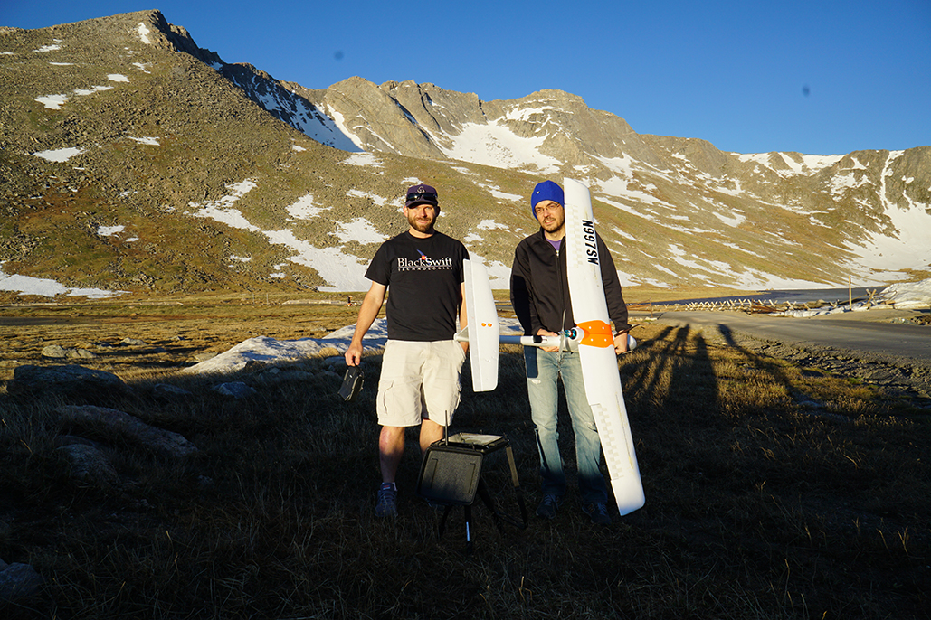 Jack Elston, PhD and CEO of Black Swift Technologies (left) prepares to pilot the SwiftTrainer™ aircraft over Mount Evans. Holding the aircraft is Maciej Stachura, CTO of Black Swift Technologies.