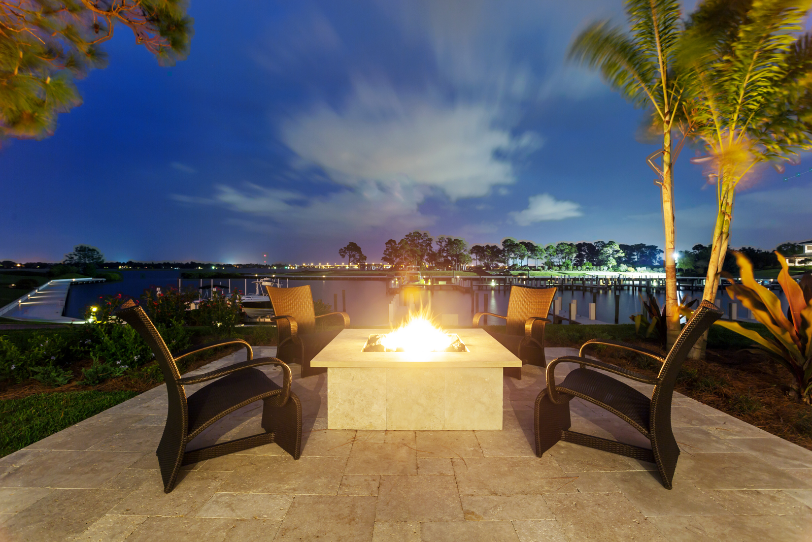 A sitting area by the docks, designed by Pineapple House Interior Design, at Floridian National Golf Club in Palm City, FL.