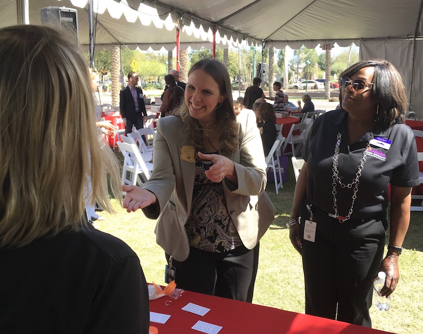 Representative Udall (Mesa) uses sign language to successfully order a cup of hot cocoa at an event simulation.