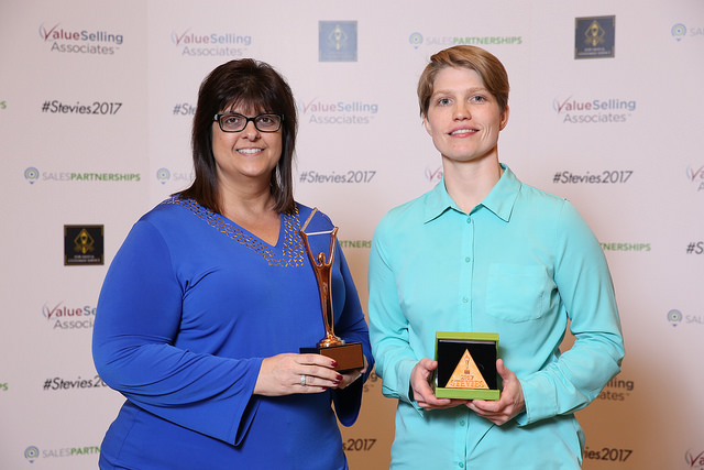 Jenny Ellingen, VP, Customer Experience & Marketing Services (on the left), and Carissa Massaro, customer experience associate, CAPM, represent the Brainier team at the 2017 Stevie® Awards ceremony
