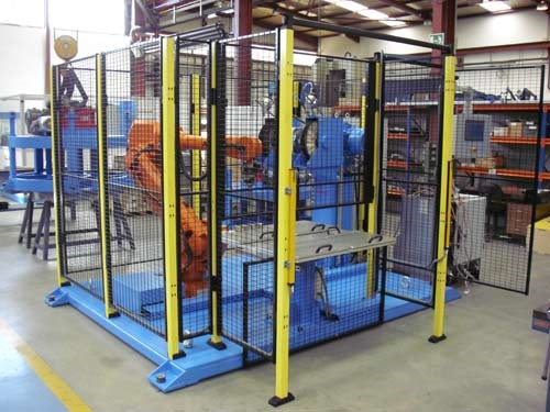 A typical fenced robot cell.