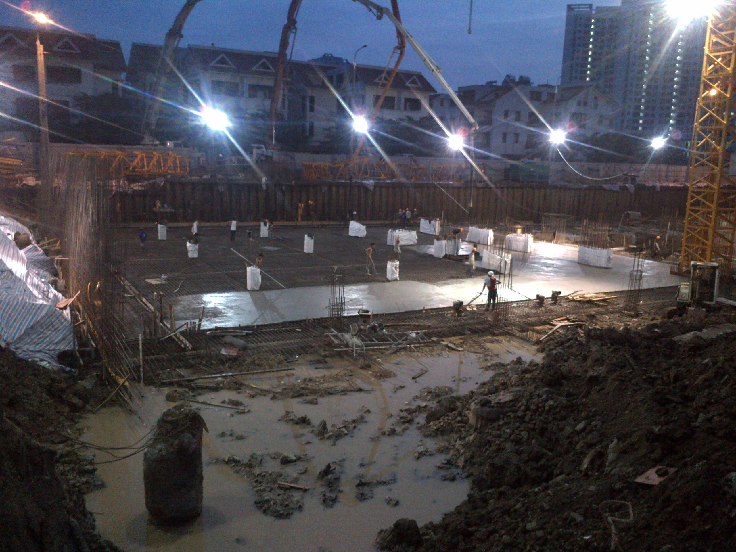 Getting started in Hanoi: The concrete pour for the foundation slabs of the An Binh City residential towers (each 28-35 floors) began at night.