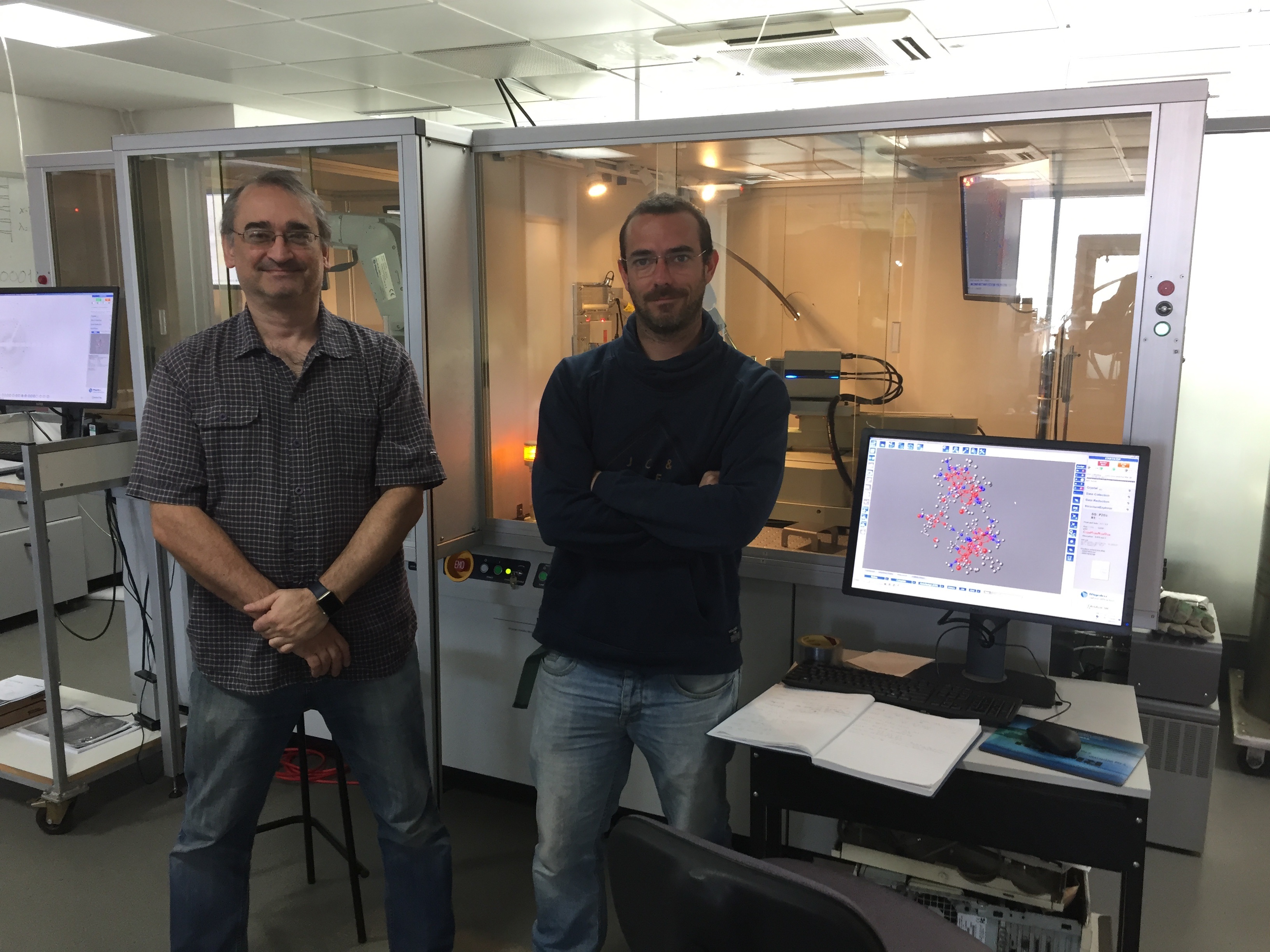Drs. Christopher Muryn and Inigo Vitorica-Yrezabal of the The University of Manchester with the Rigaku XtaLAB FR-X DW X-ray diffractometer system