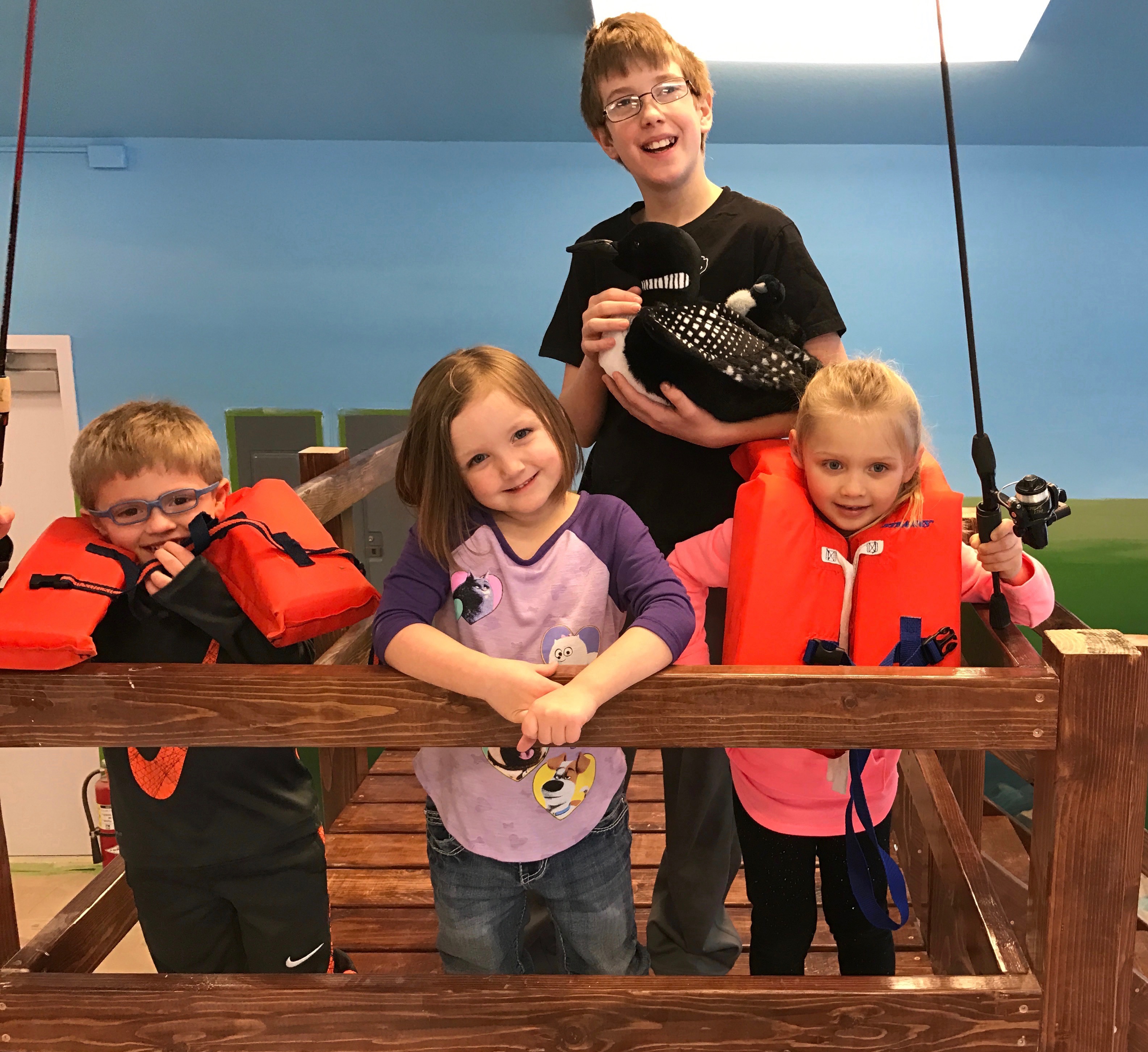 An indoor fishing dock is a central part of "Lake Life" at the Children's Discovery Museum