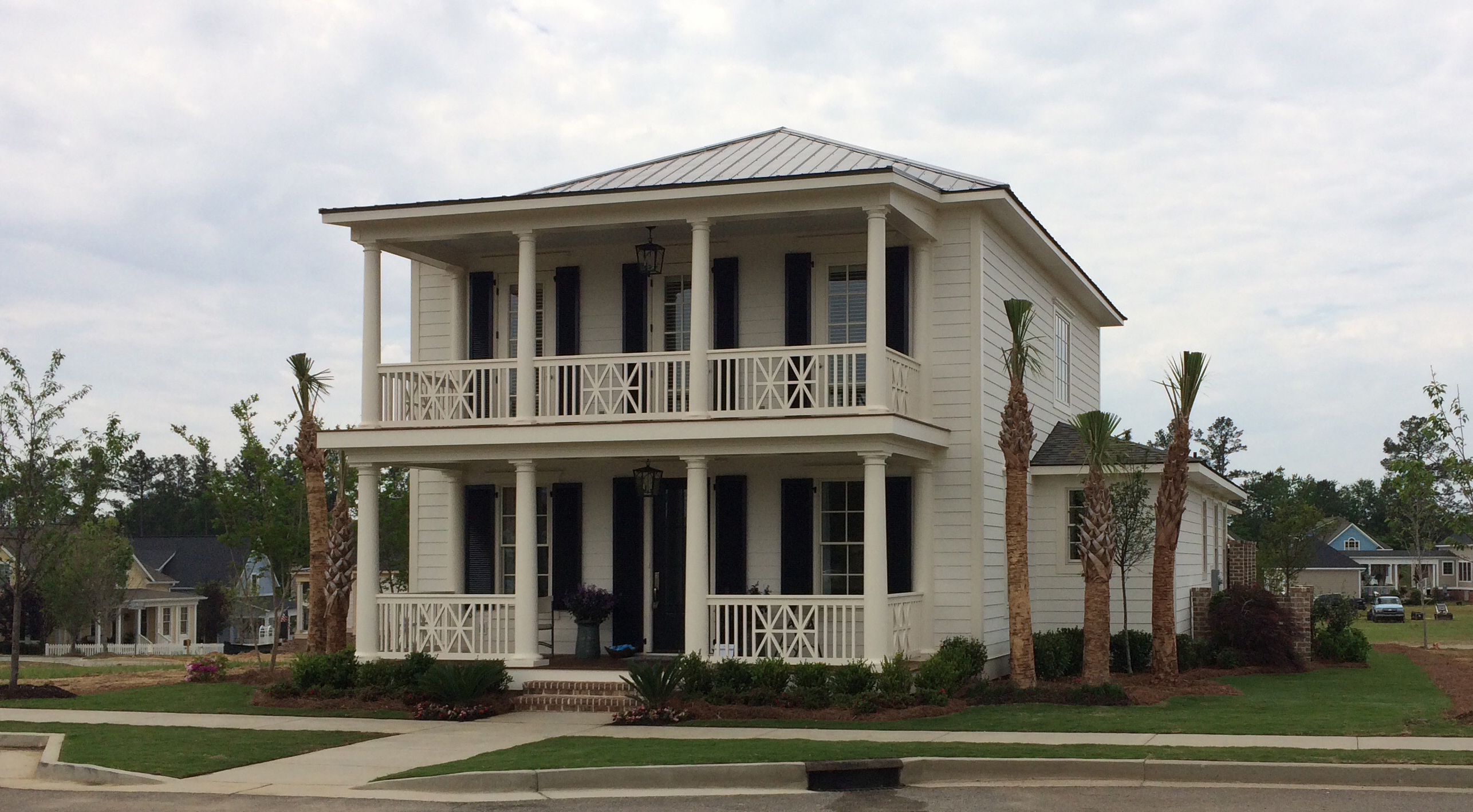 The Savannah home of the Village at Woodside is prepared for tours with a green TifTuf lawn.