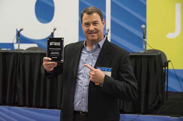 SVP Ken Bisnoff accepts the first-ever Channel Partners Choice Award for TPx.