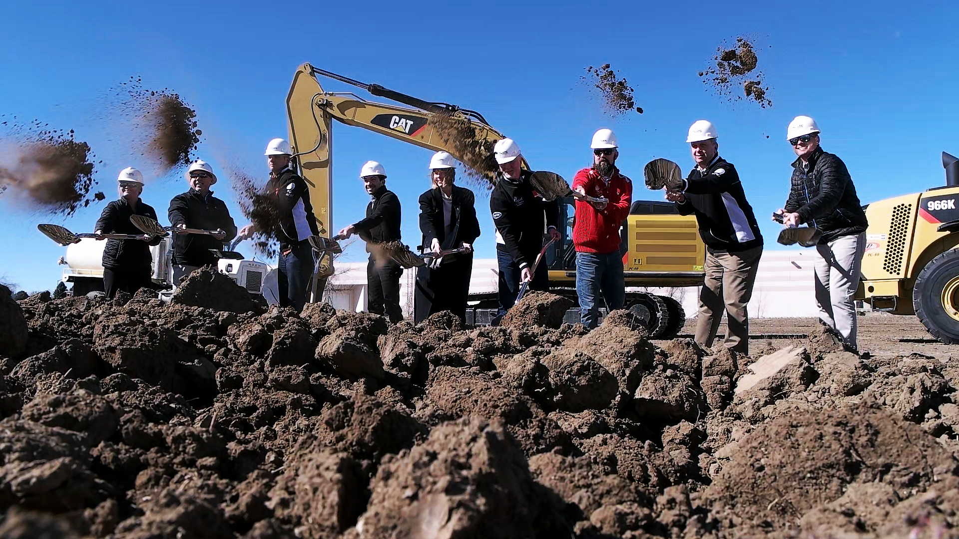 Key members of the RUPES USA management team toss the first few shovels of earth on what will be the new US headquarters
