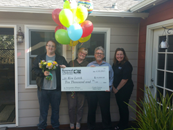 Renewal by Andersen of San Francisco replacement windows and patio doors presents check to winners