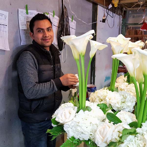 Andrews Wholesale Flowers Team Member Martin Sanchez Making Life Beautiful with Calla Lily and Hydrangea Centerpieces