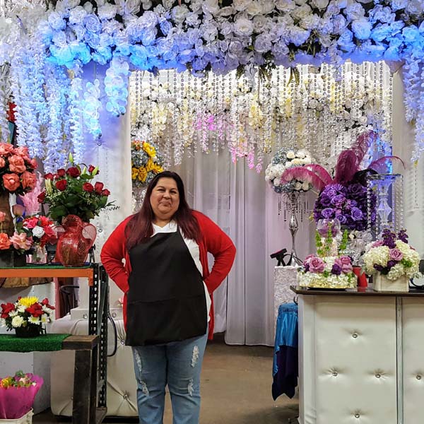 Myrna Alba owner of El Poblano Flowers soon in front of the new 110 showroom