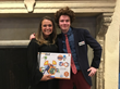 Ethan Wadsworth, YAA honoree, with Julie Blakeman, winner of a raffle for a set from Guidecraft featuring Ethan's characters and graphics