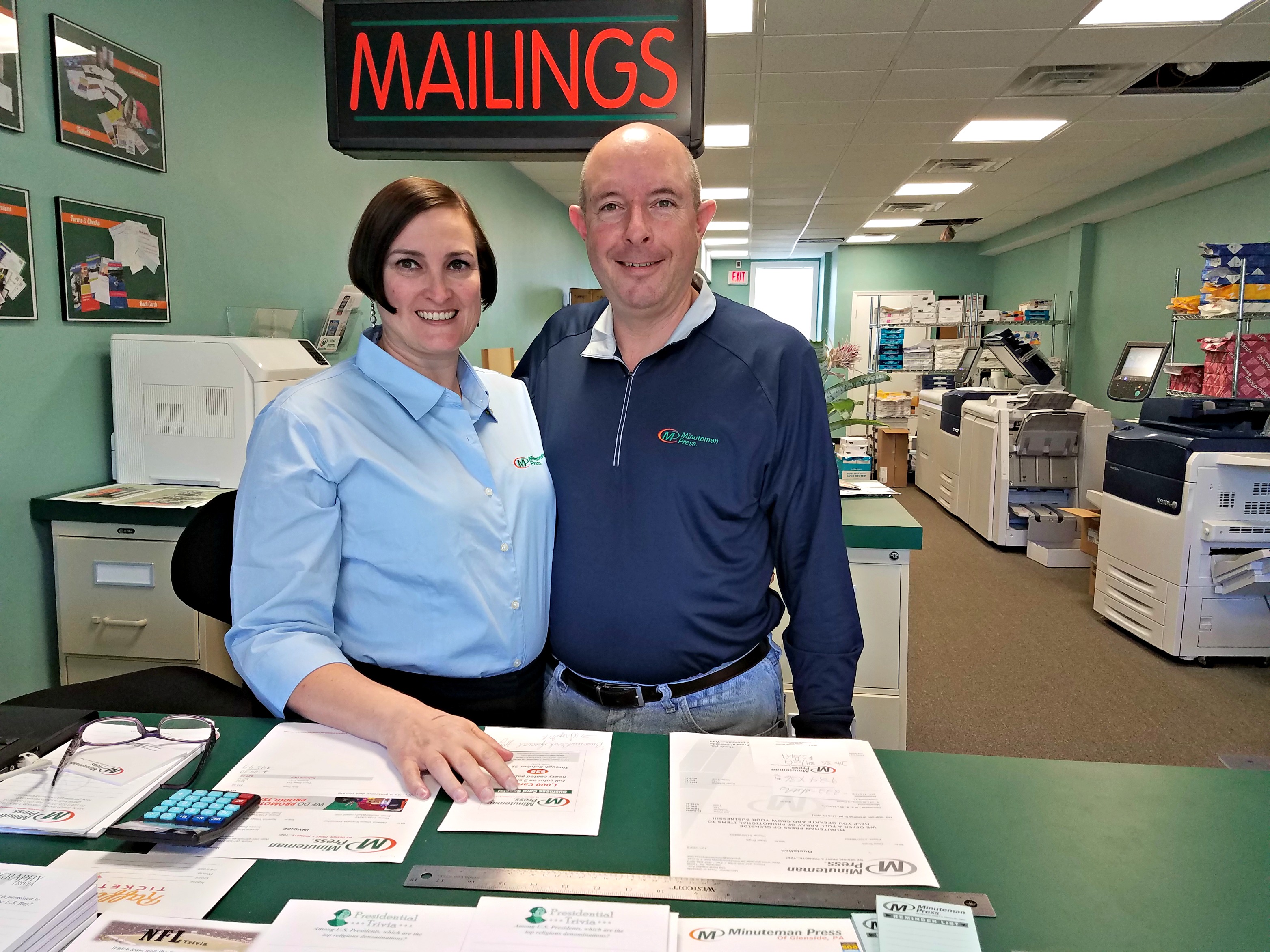 Lyn and Charlie Church inside their Minuteman Press center in Glenside, PA.