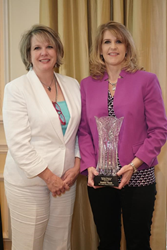 Debbie Vereb receiving Business Woman of Excellence award from NFCC