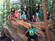 Campers explore the redwood forest