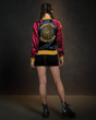 Wonder Woman has now inspired her own collection of fangirl fashion, courtesy of powerhouse brand Her Universe. Part of the collection includes this Daughters of Themyscira Souvenir Jacket (back).