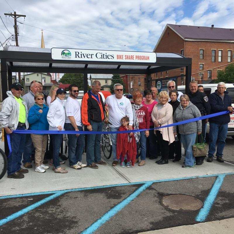 Celebrants gather in front of Velodome's Newport bike shelter in Aurora, IN. to inaugurate the River Cities Bike Share Program.
