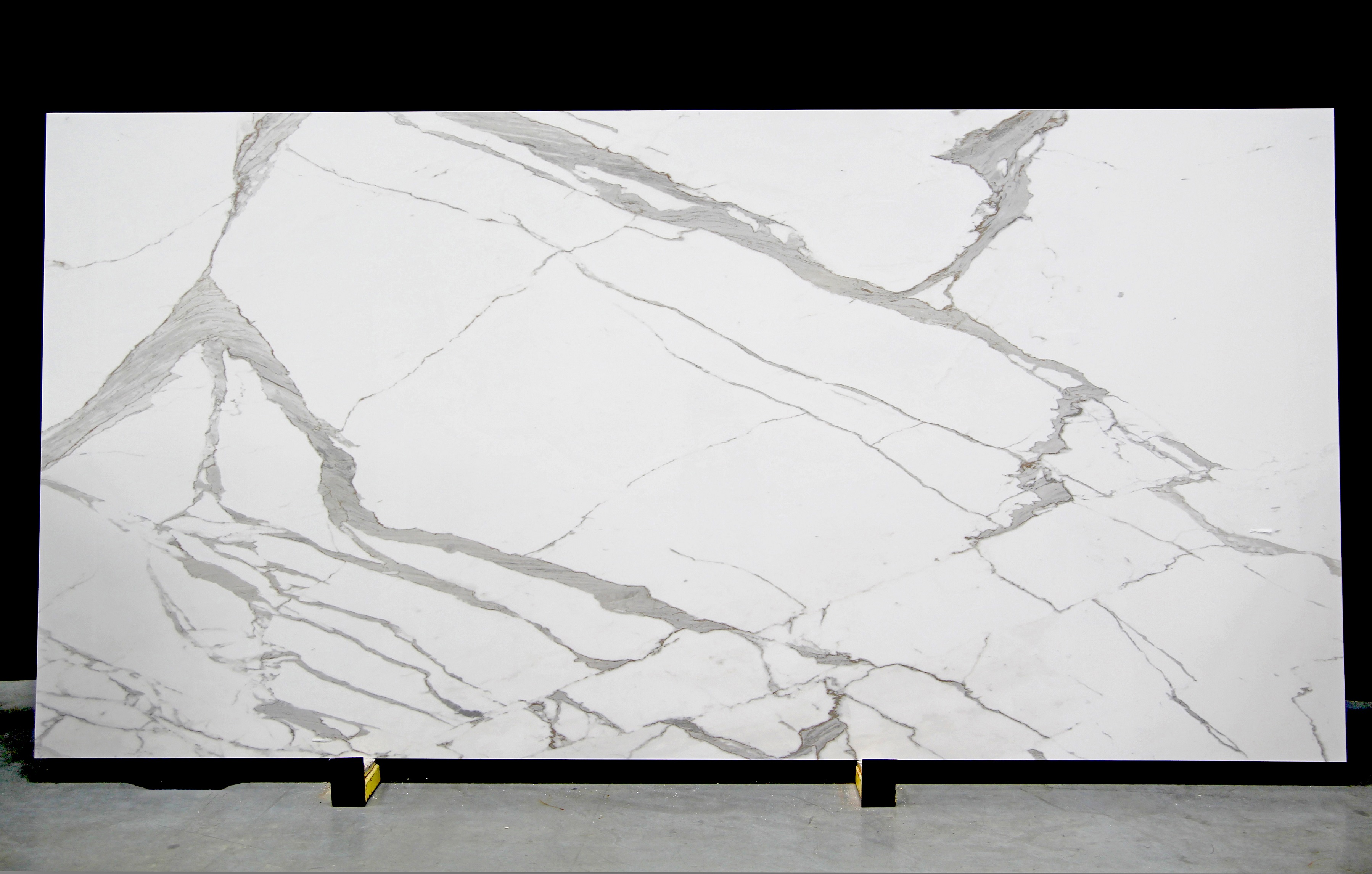 Walker Zanger is among the first in the industry to offer entire slabs up to 126 inches by 63 inches to use as countertops. Shown: Calacata Classic.