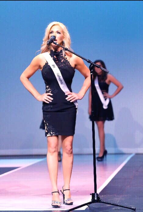 Carla Gonzalez opening number segment at the Ms. World Pageant  wearing a Sheri Hill design