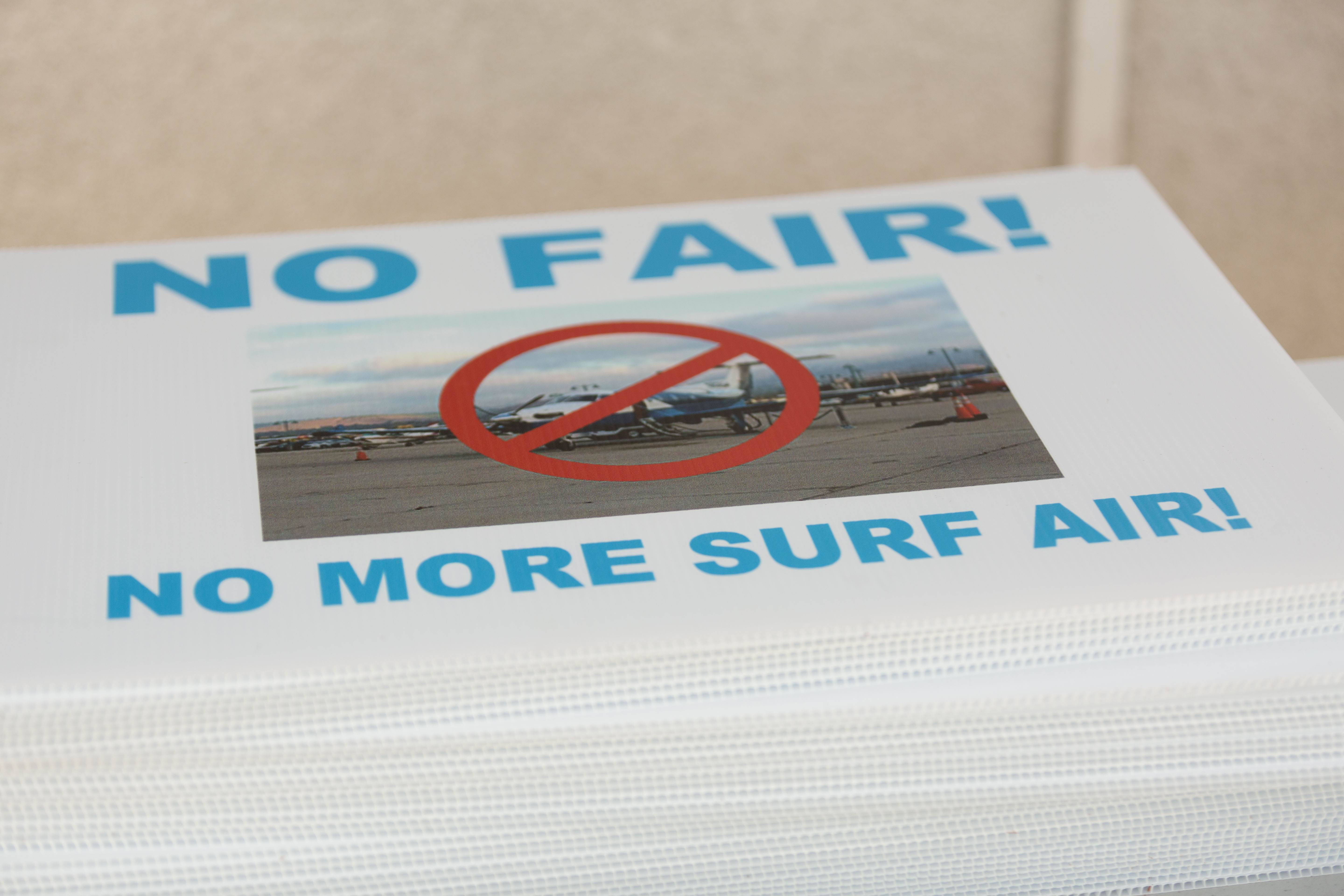 Surf Air Protest signs at San Carlos Airport (KSQL) in the San Francisco Bay Area on June 17th, 2017