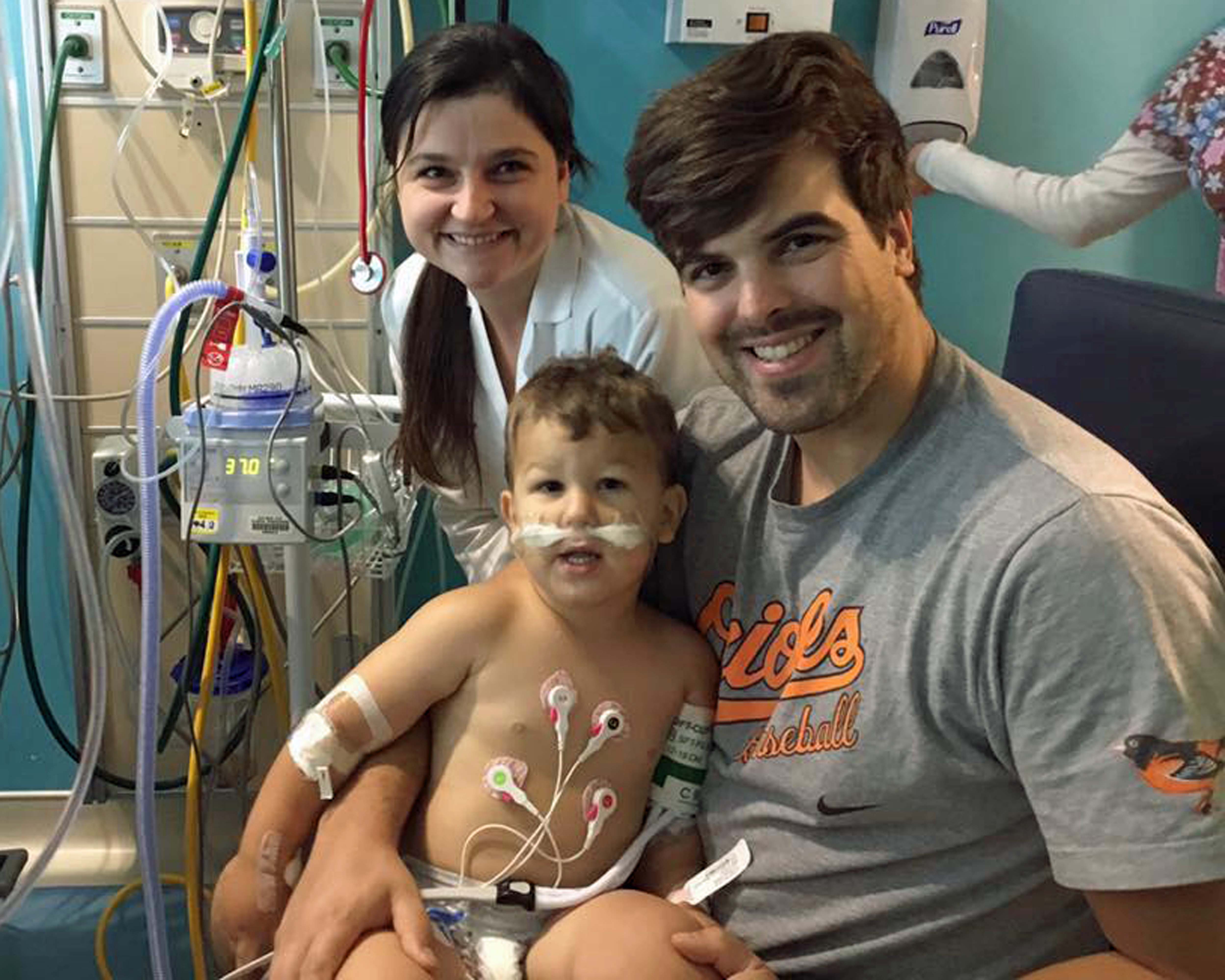 Two year old Judah Anderton, pictured with his parents Angela and Benjamin Anderton, is expected to make a full recovery