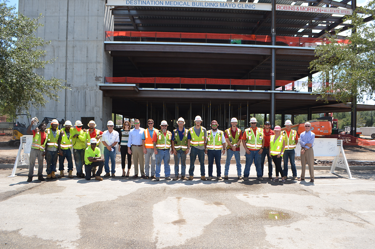 Robins & Morton celebrates the topping out of the Destination Medical Building.