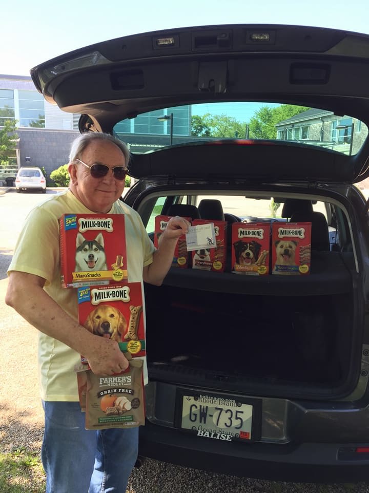 As a Radiant Act of Kindness, Stan Slonka, Executive Director of Blenheim-Newport, delivers treats for cats and dogs at The Potter League animal shelter in Newport, R.I.