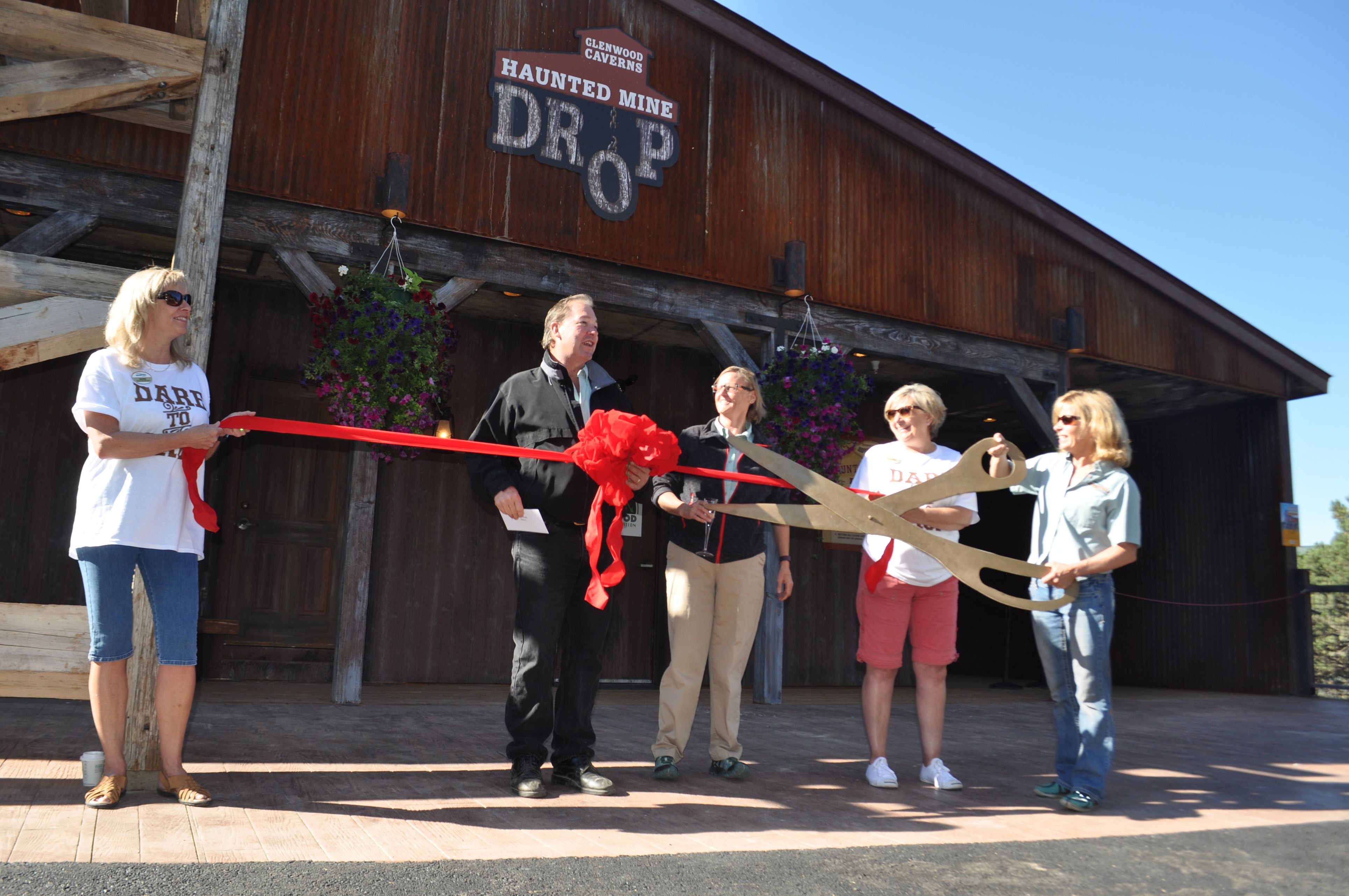 Park owners Steve and Jeanne Beckley cut the ribbon at the grand opening of the world's first drop ride to go underground.