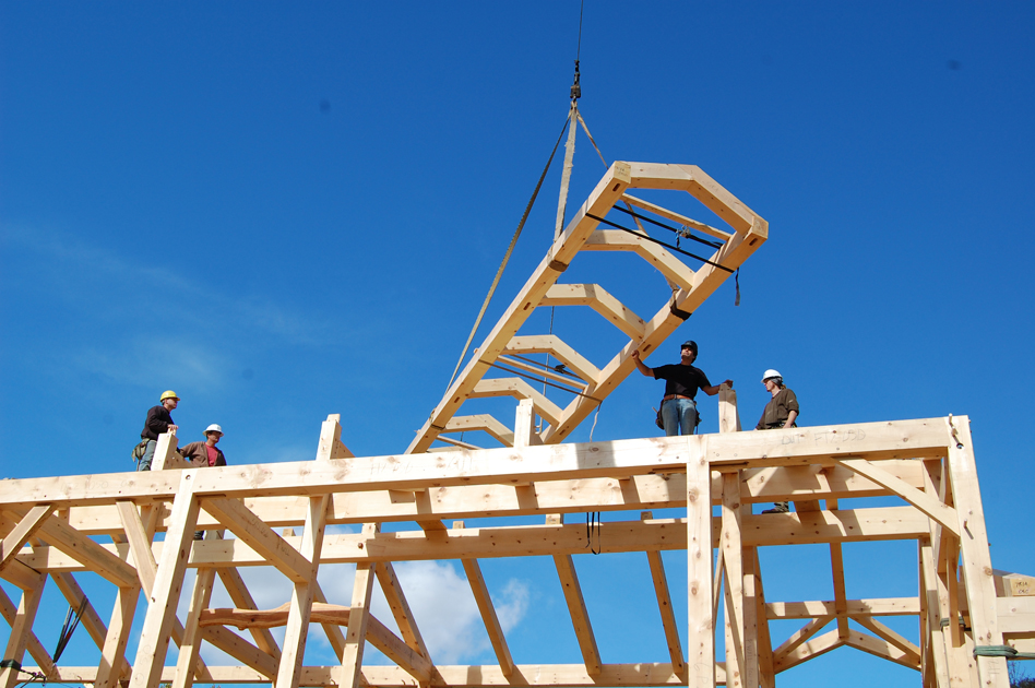 New Energy Works timber frame craftsmen raise the clerestory for a private home in Honeoye Falls, NY.