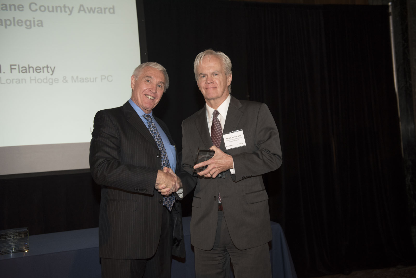 Attorney Patrick Flaherty accepting Trial Lawyer Excellence Award