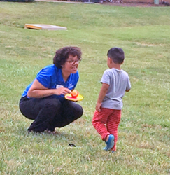 Ryan Drigo, Assistant Branch Manager, Springfield Town Center, takes a break from delivering lunches to play catch with a youth.