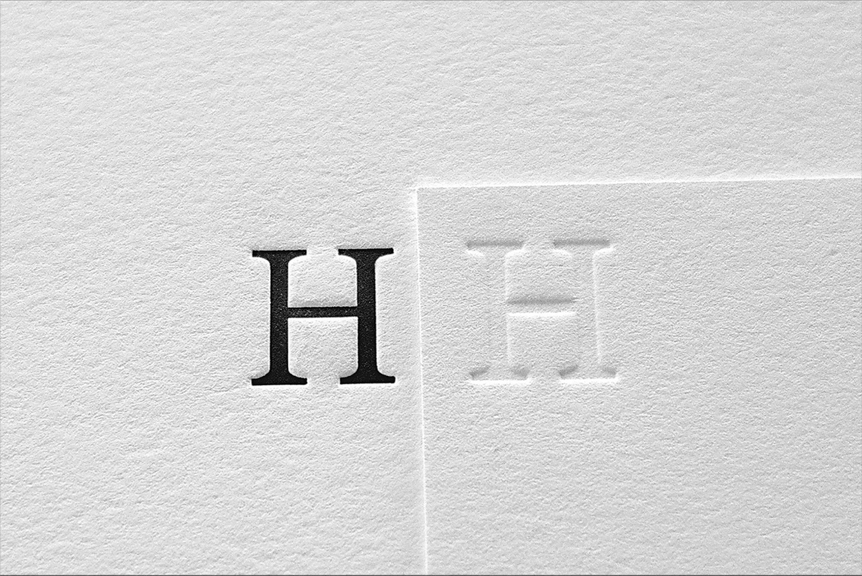 Letterpress directly imprints the paper, leaving a faint impression that catches a subtle shadow and adds character to the printed page