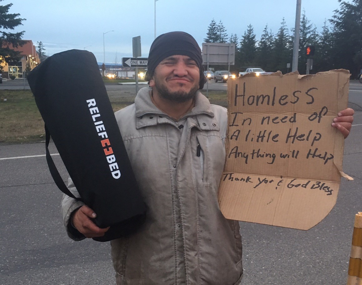 Homeless Man Recieving Relief KIT