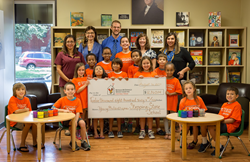 Stepping Stone School Students' present a check to Ronald McDonald House Charities of Central Texas for $12,860.14