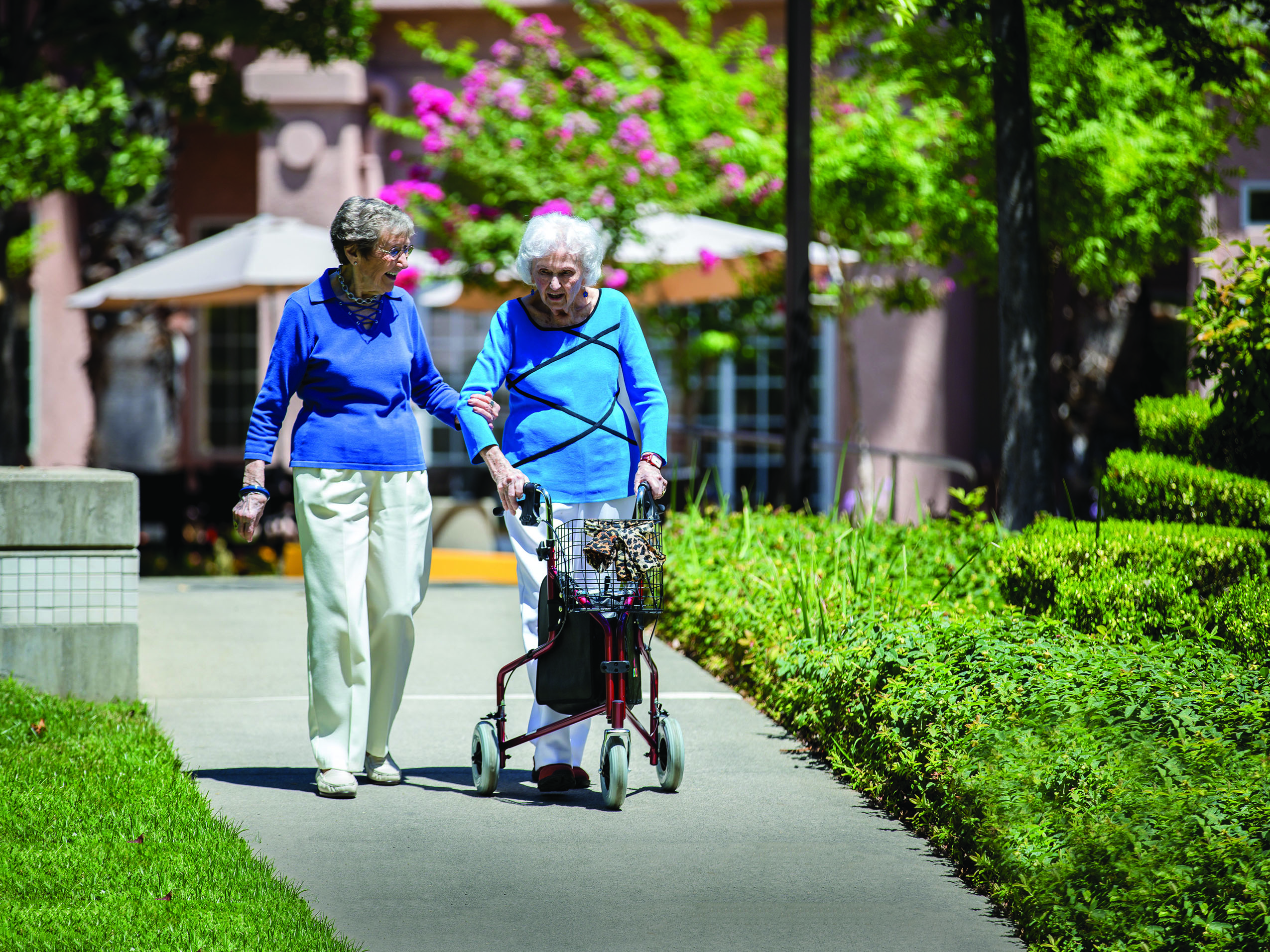 Clea Meyers, 100, and Jeannie Jones, 97, enjoy walks together around Eskaton Village Carmichael. Clea uses a pedometer to make sure she walks 7,000 steps daily.
