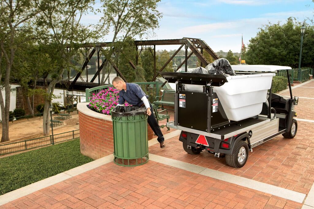 Speed trash removal with the Carryall 700 Refuse Removal Vehicle with high dump.