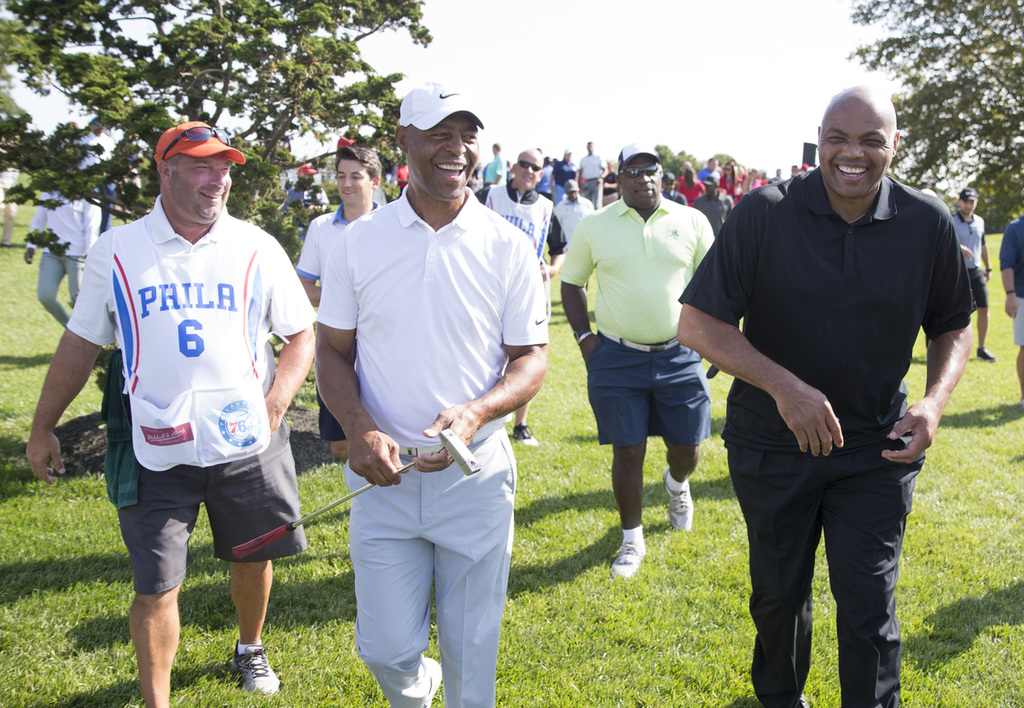Marcus Allen (L) and Charles Barkley (R) make their way from 18 Green to the Clubhouse after the Erving Playoffs at The Ace Club