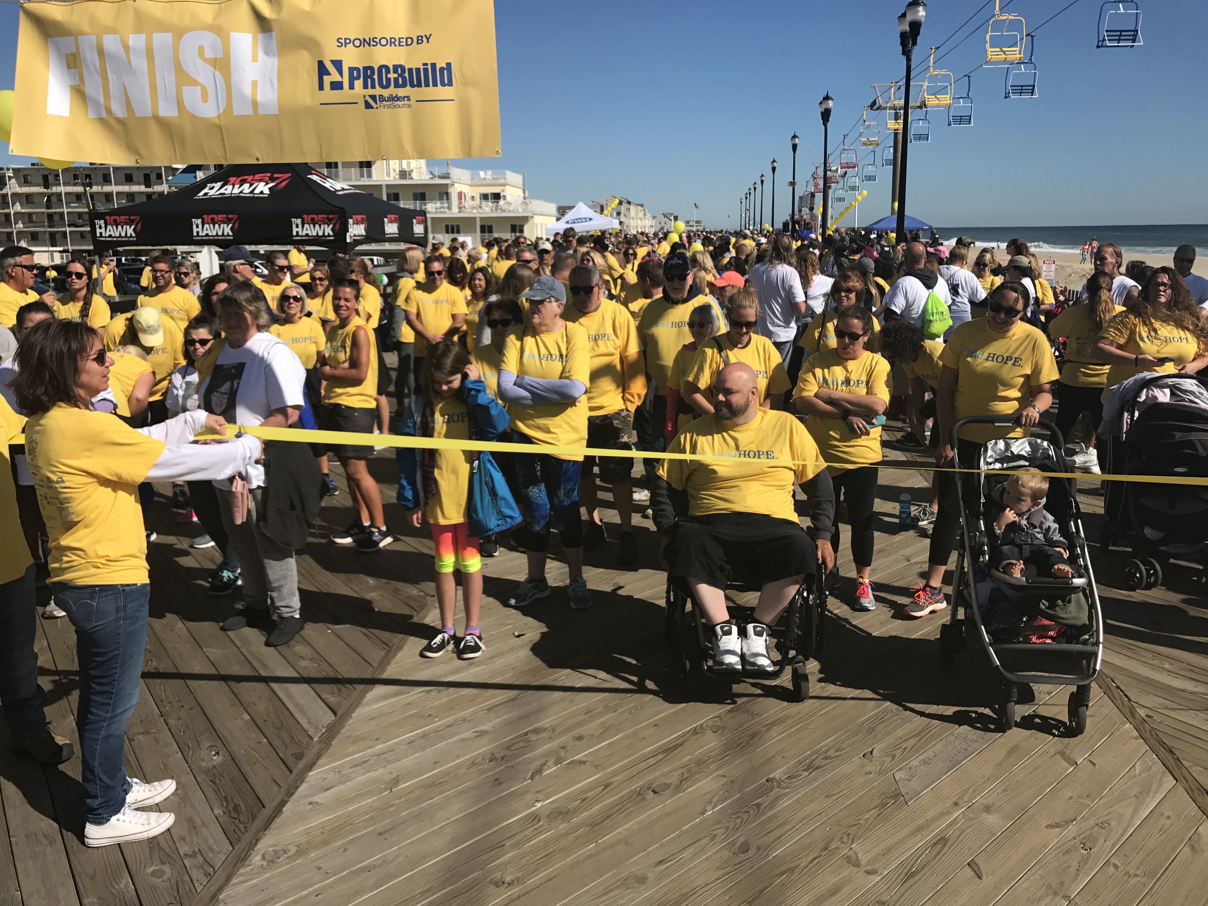 Walkers start their journey down the Seaside Heights boardwalk.