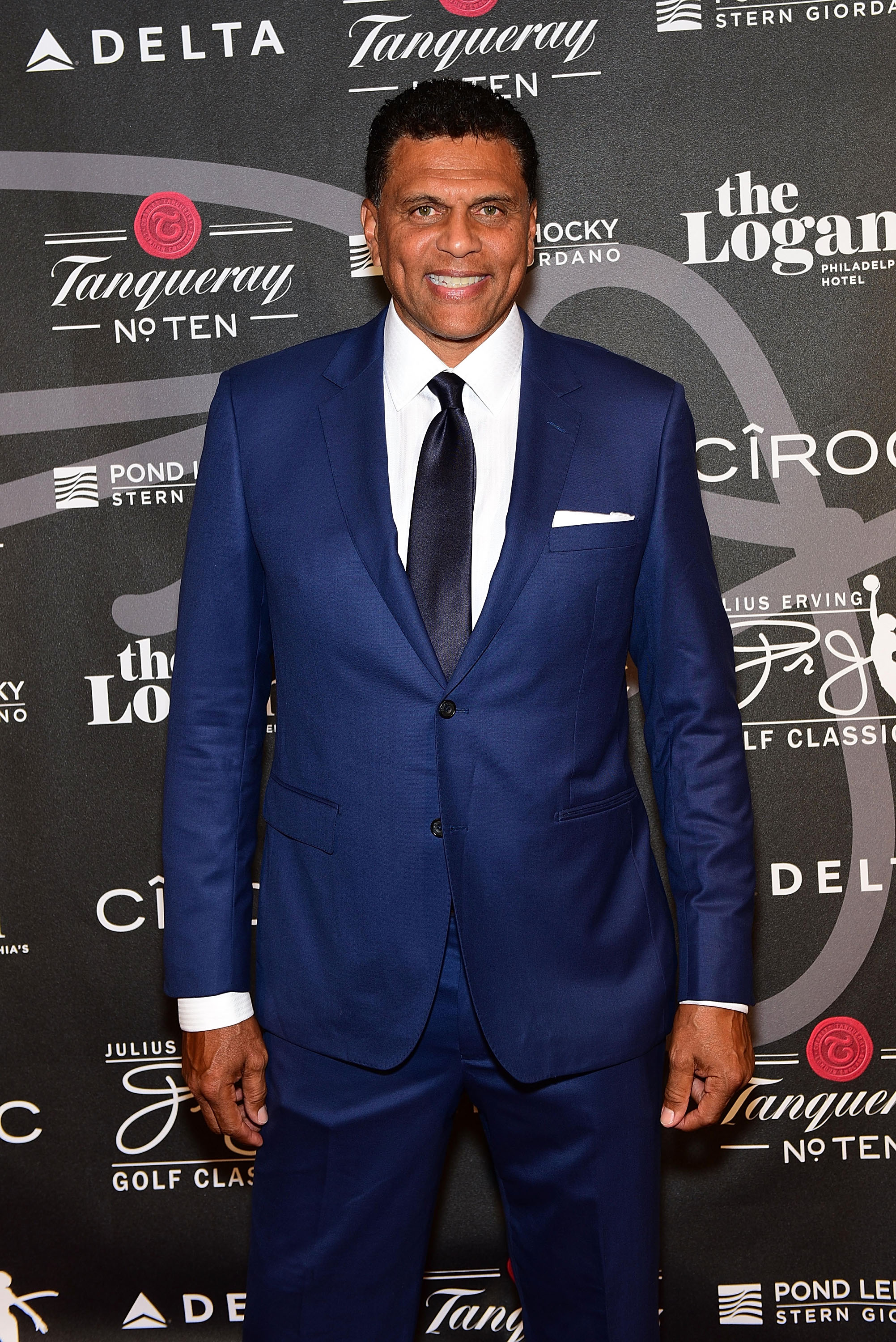 Reggie Theus walks the red carpet at The 2017 Erving Black Tie Ball and Pairings Party in Philadelphia wearing a custom JB Clothiers suit