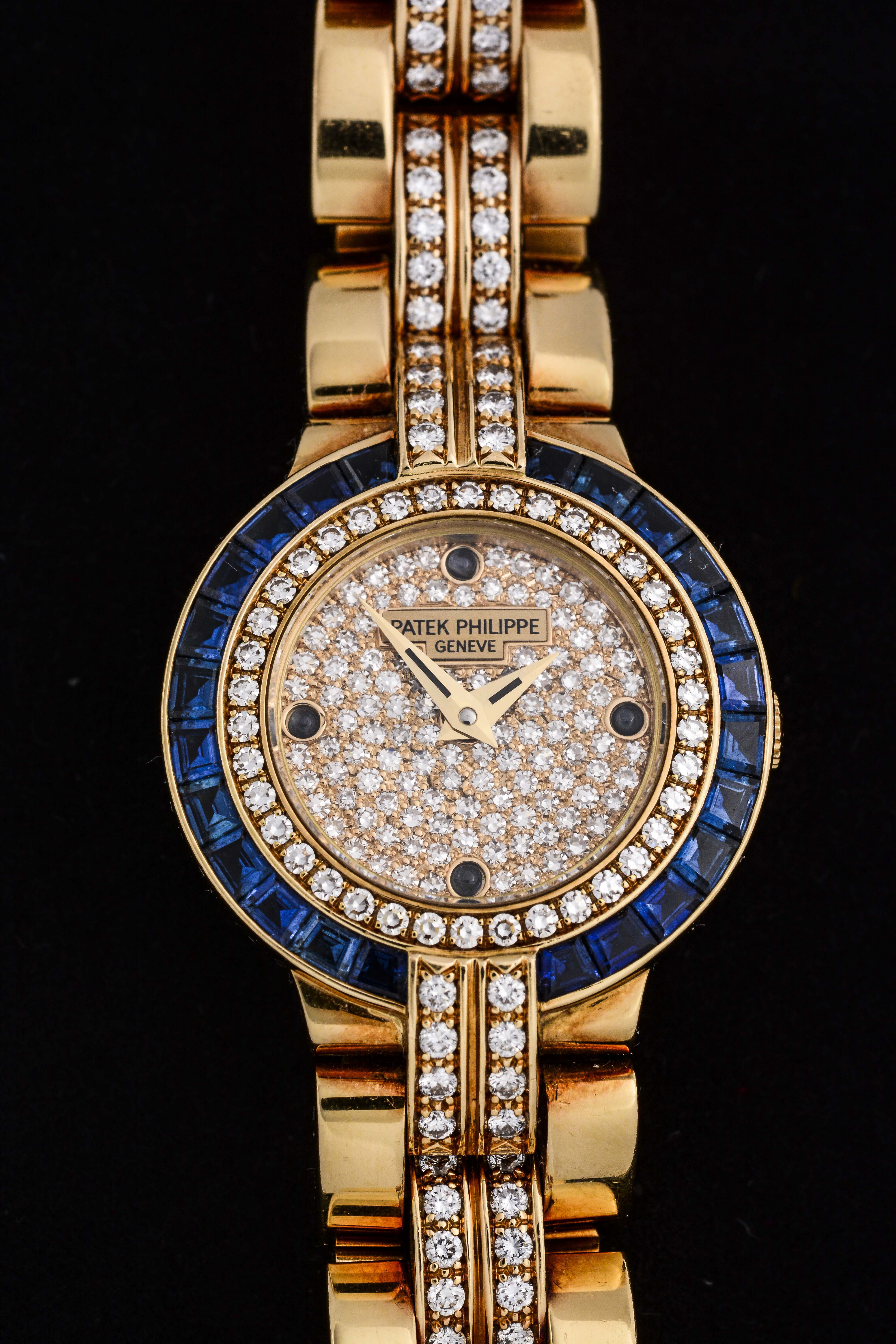 Patek Philippe 18K Diamond and Sapphire Set Ladies Watch, estimated at $21,000-26,000.