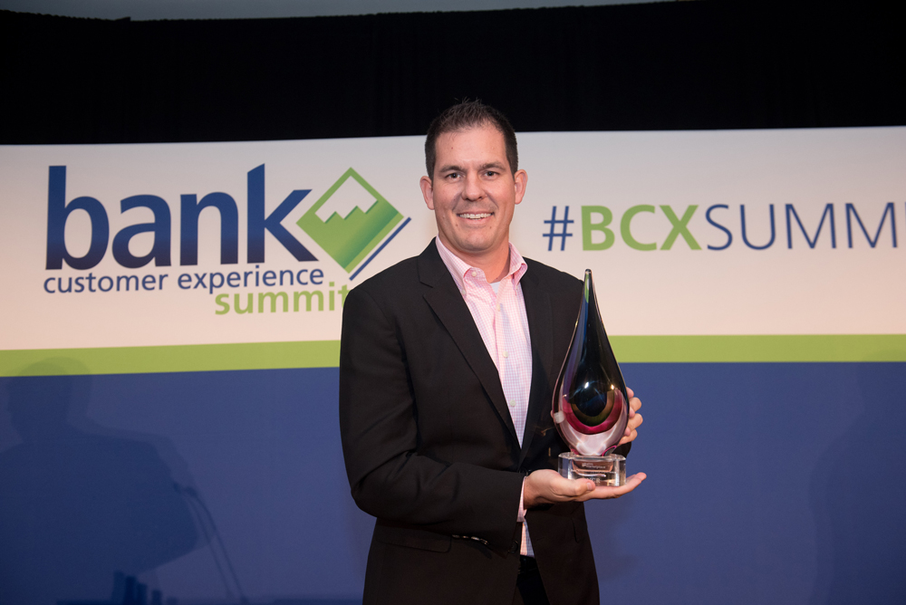 Chad Bruhn, Vice President of Sales at NCR, accepted the award for Best ATM / Self-Service Experience.