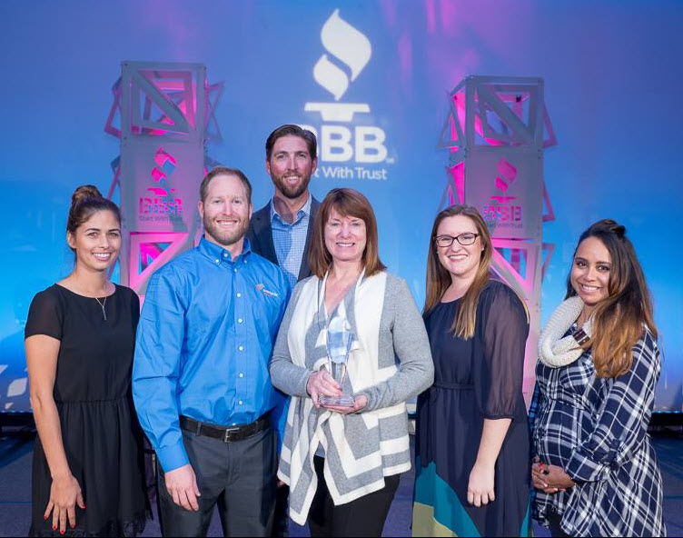 On November 29, 2016 Baker Electric Solar team members accept the 2016 BBB Torch Awards for Ethics in the 100-499 employee category