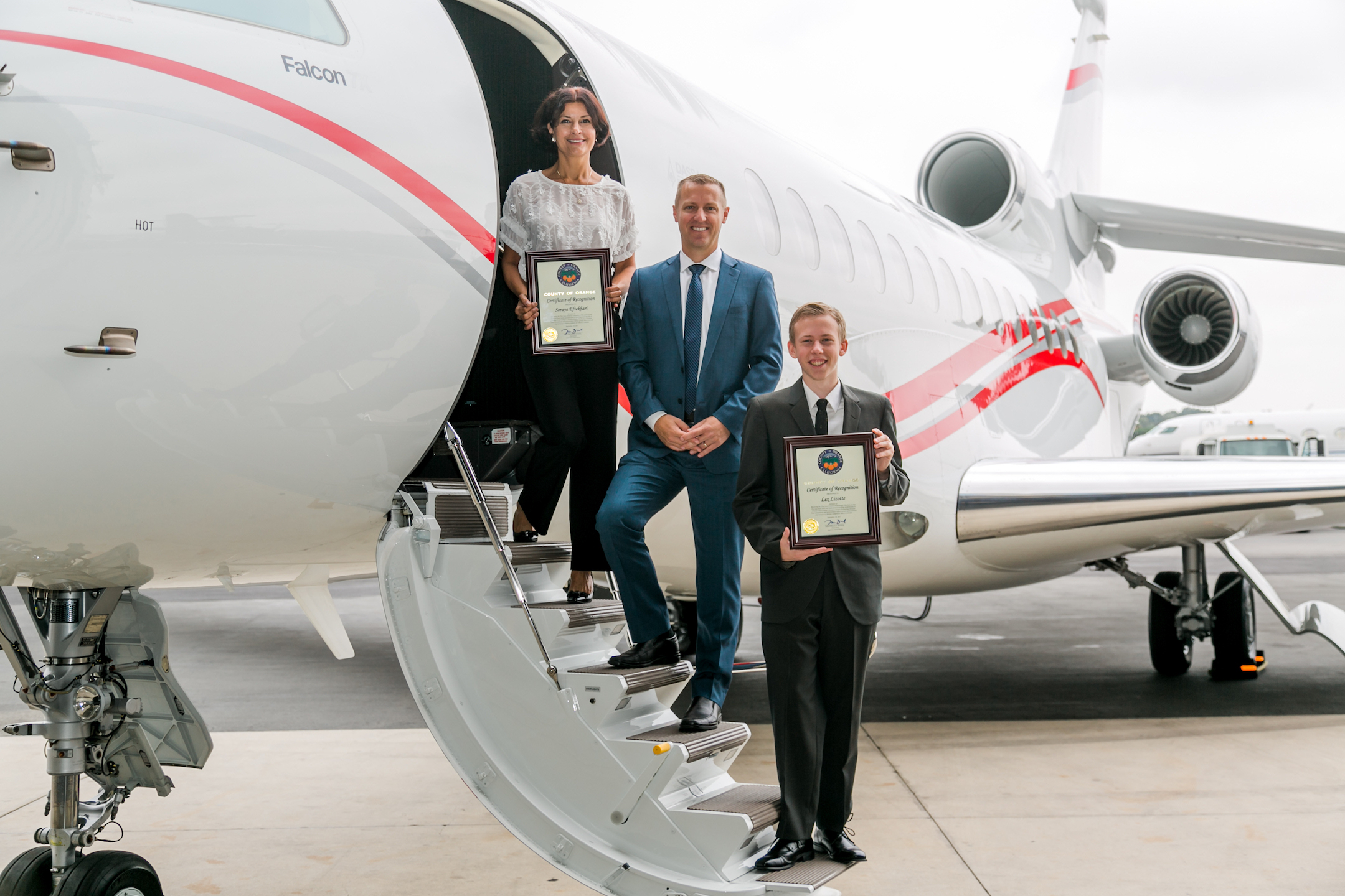 Scholarship Recipients Lex Lizotte and Soraya Eftekhari with Scott Cutshall, VP Clay Lacy Aviation at John Wayne Airport